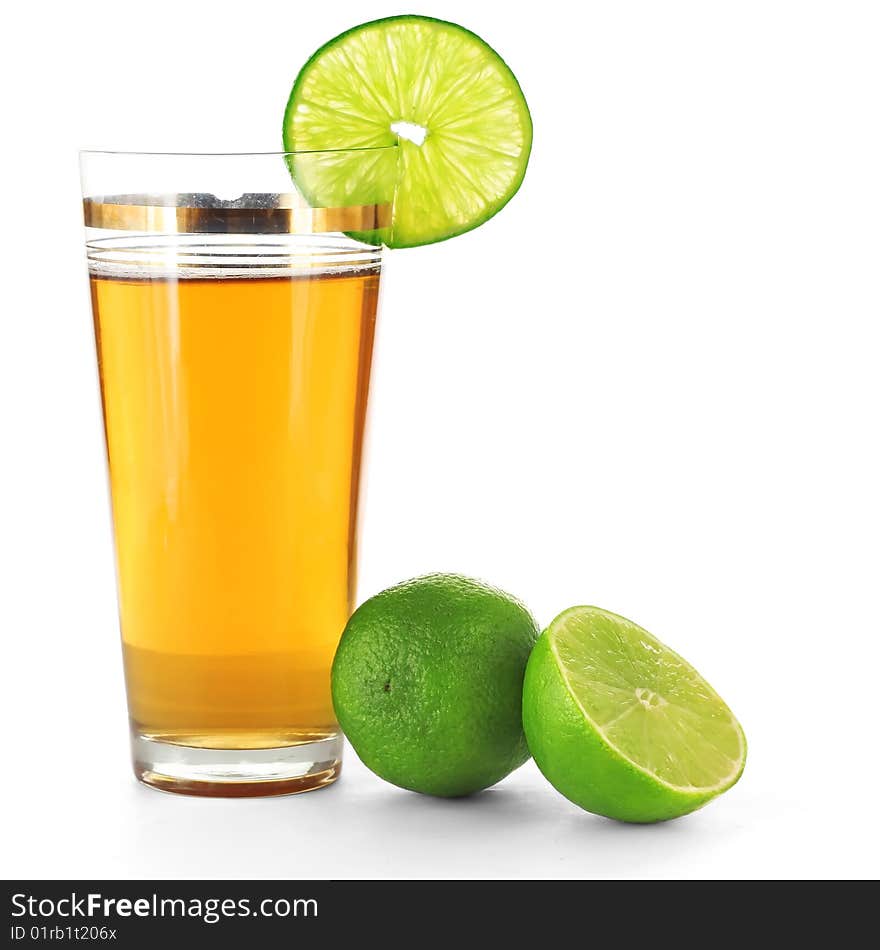 Limes and juice in glass