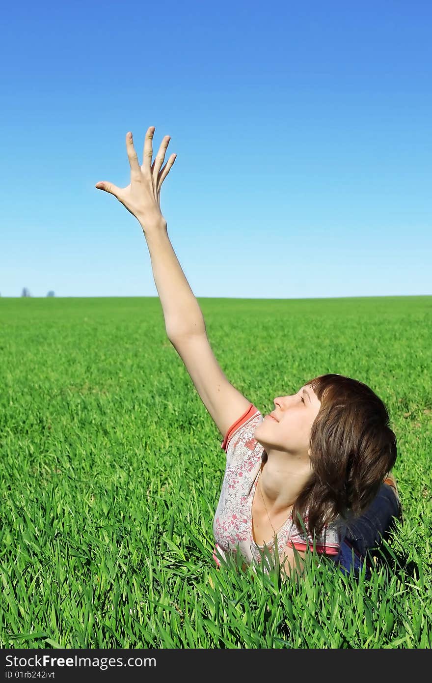 Young woman in green grass