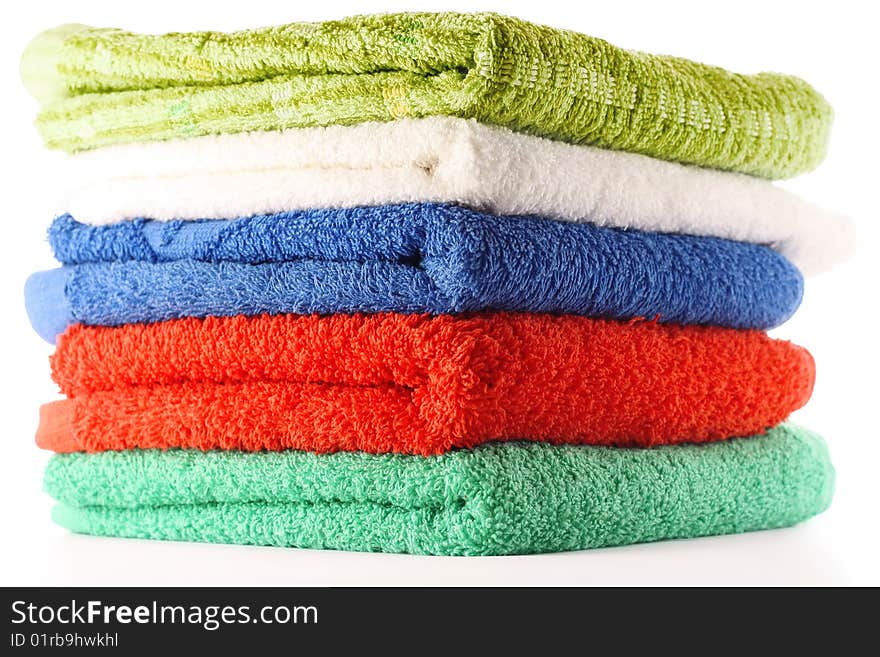 Colored bath towels isolated on white