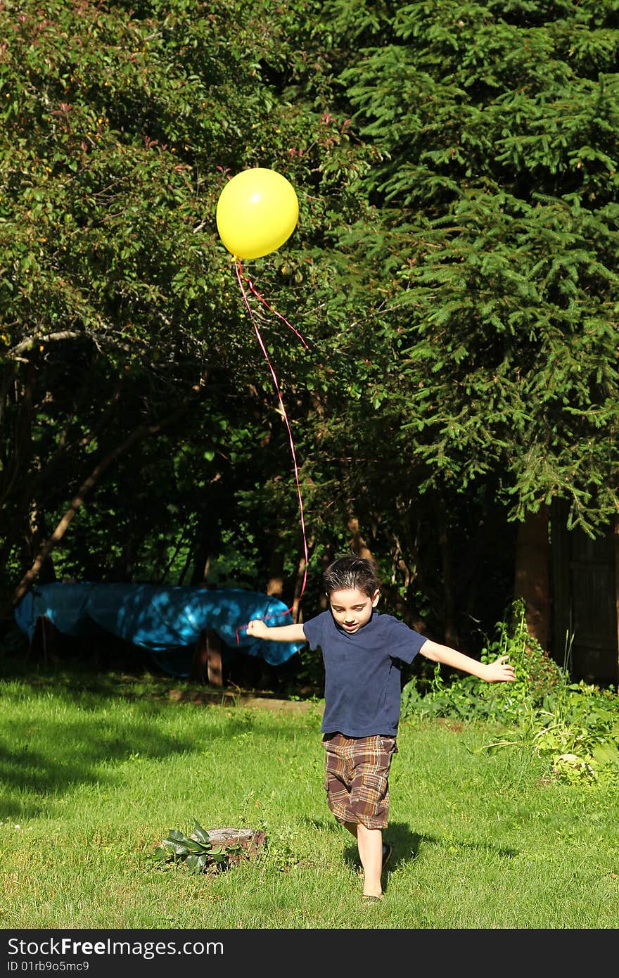 Boy Playing With Balloon