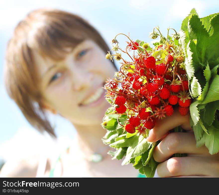 Young smiling woman with srawberry bouquet. Young smiling woman with srawberry bouquet