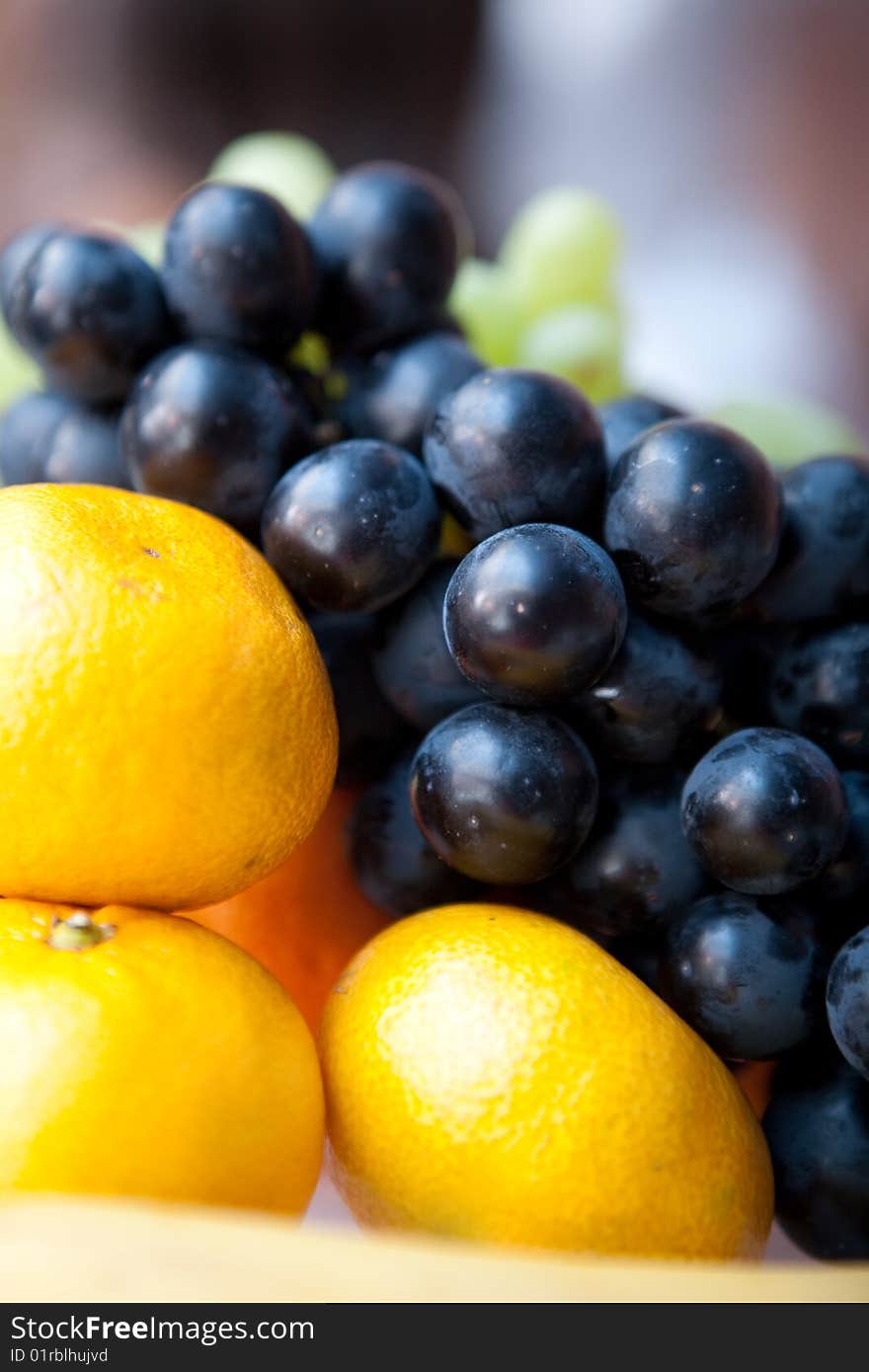 Oranges and grape on the table. Oranges and grape on the table