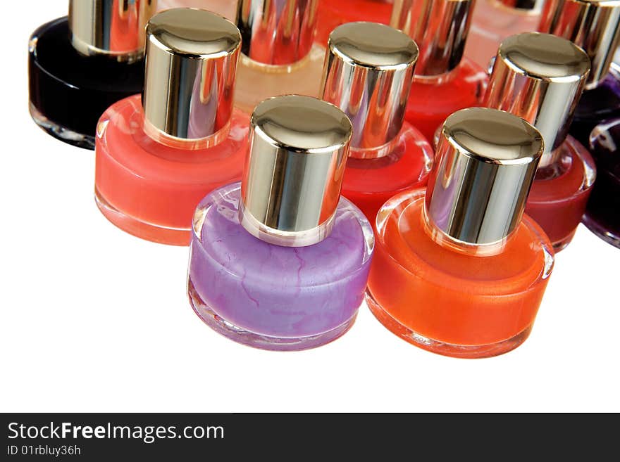 Group of bottles of colour nail polish on a white background. Group of bottles of colour nail polish on a white background