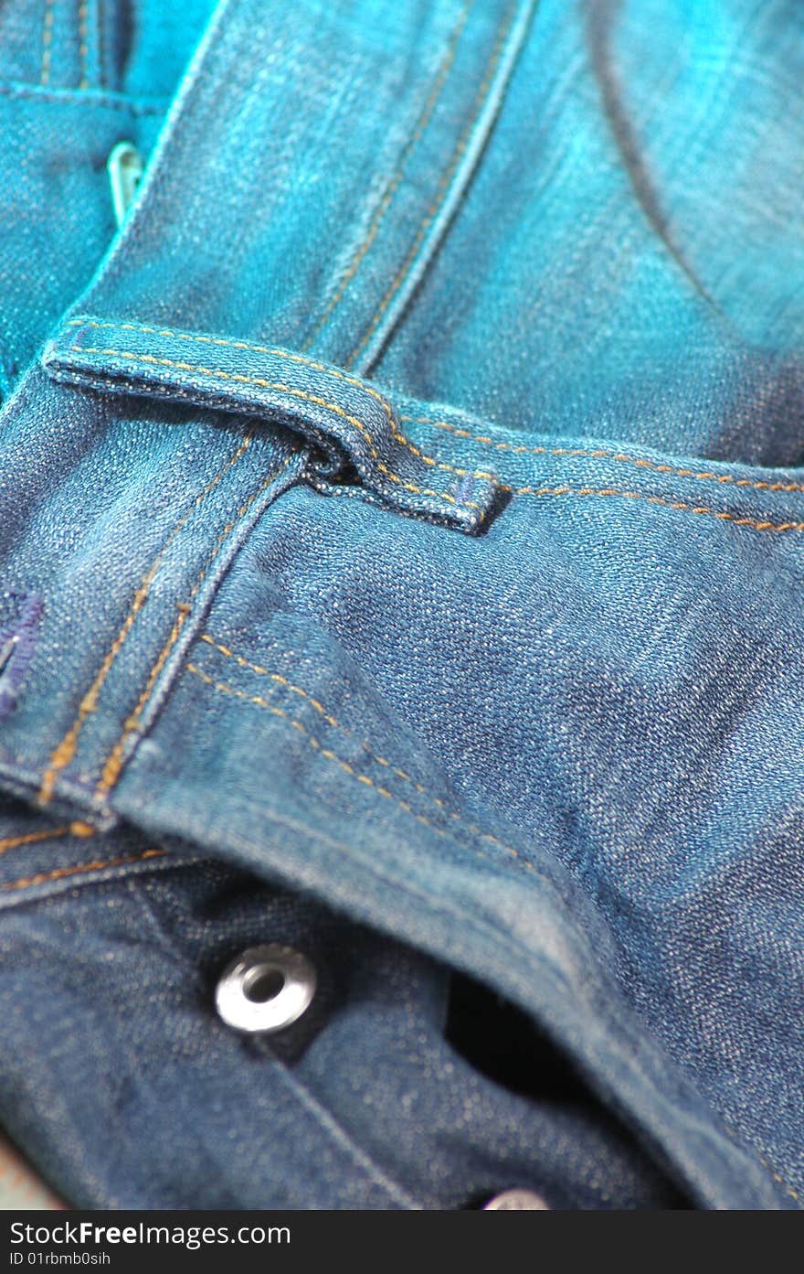 Close up background texture of a pair of denim jeans. Close up background texture of a pair of denim jeans
