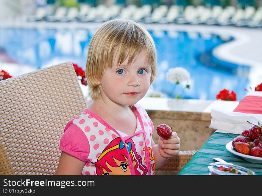 Young girl eating in restaurant. Young girl eating in restaurant