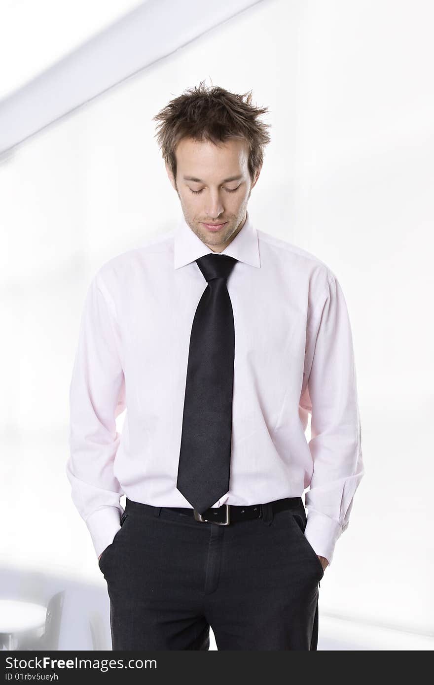 Businessman standing with hands in pocket