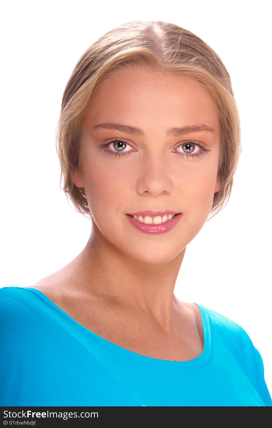 Portrait of a beautiful young blonde in a blue jacket on a light background. Portrait of a beautiful young blonde in a blue jacket on a light background