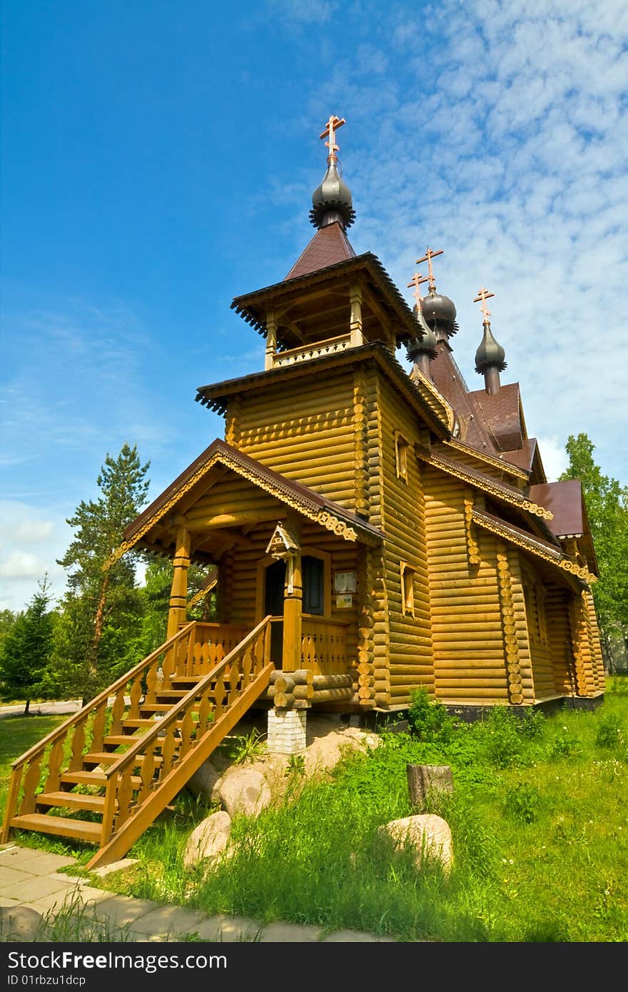 Beautiful wooden church on the background of blue sky. Beautiful wooden church on the background of blue sky