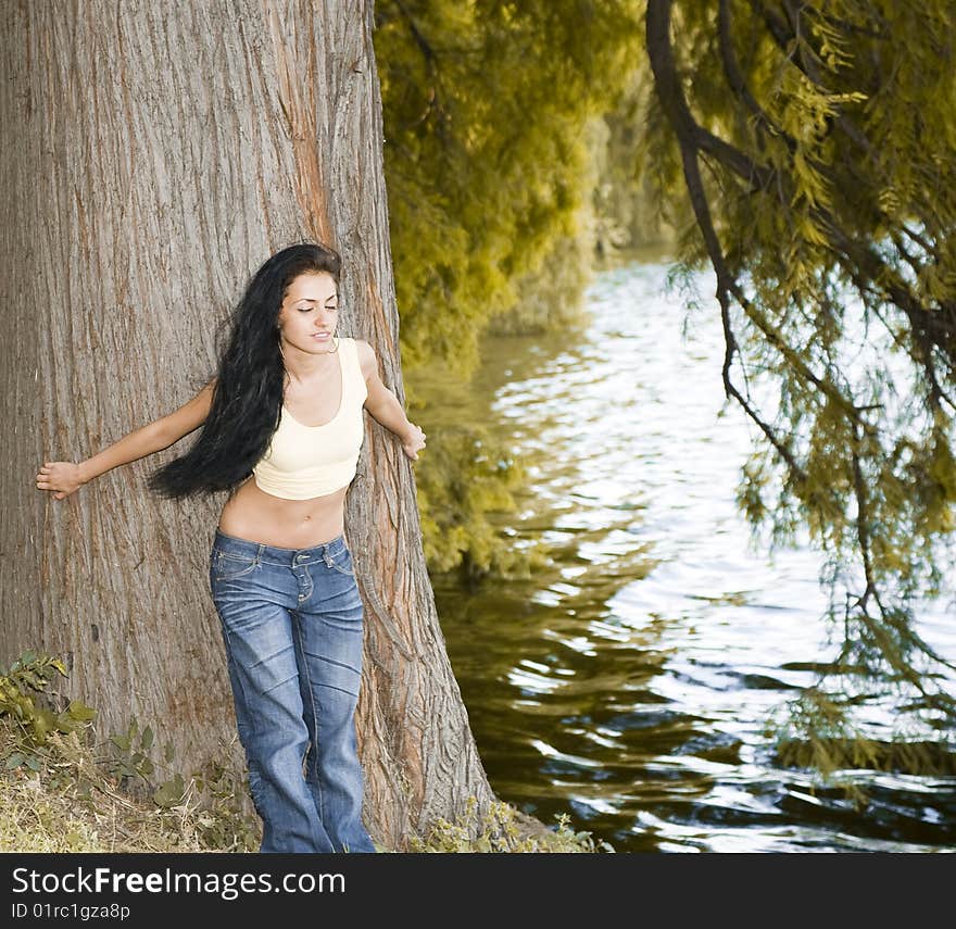 Girl standing on a lake shore. Girl standing on a lake shore