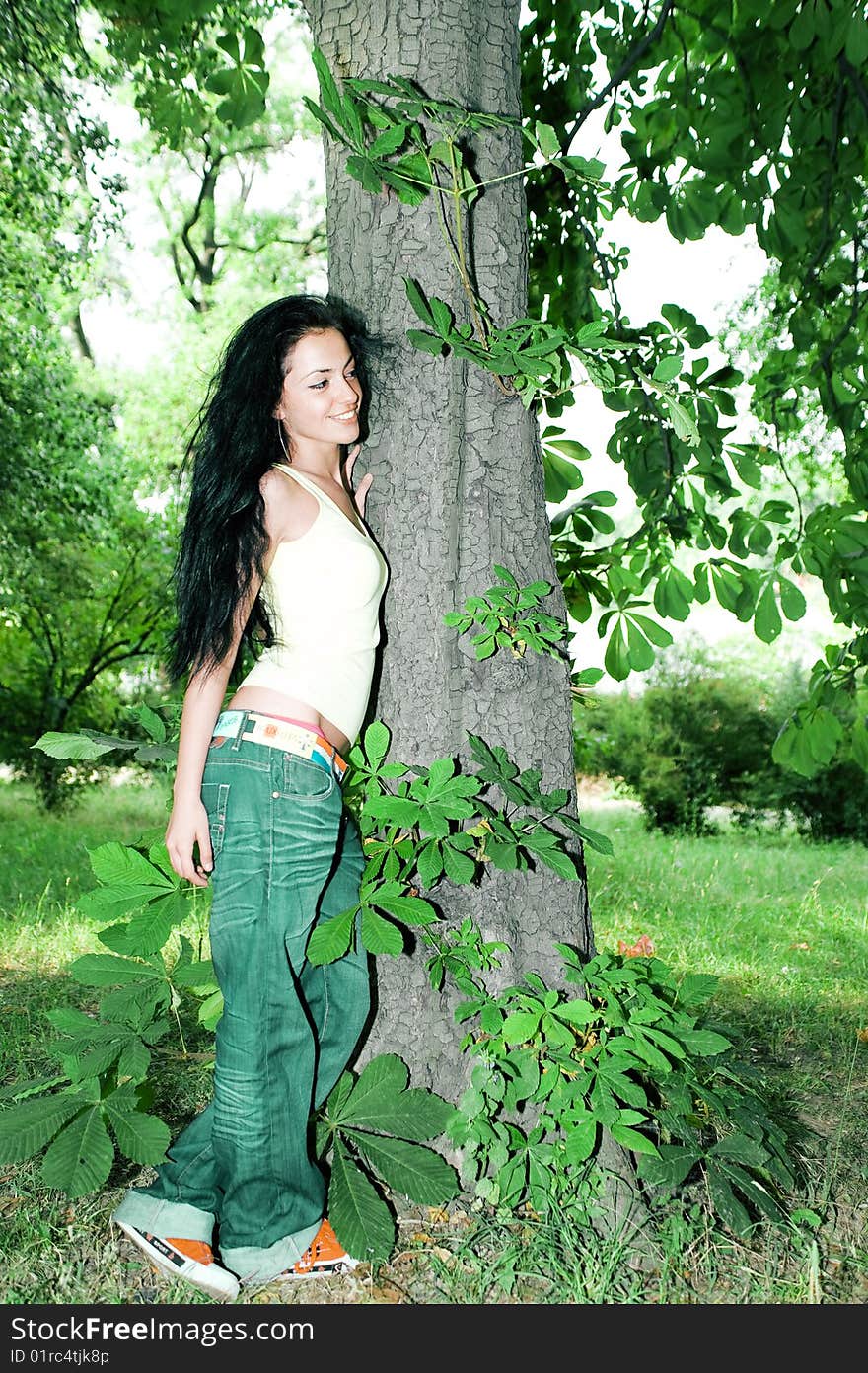 Beautiful young girl in the forest