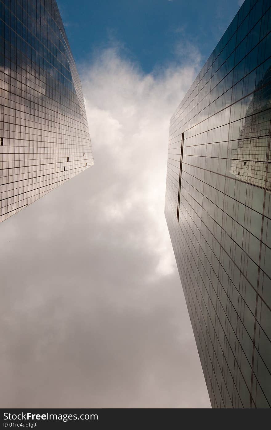 Stormy sky reflected in a modern glass office building. Stormy sky reflected in a modern glass office building