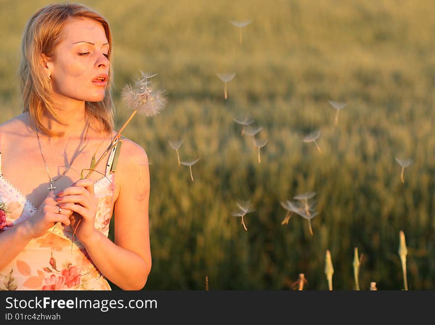 Woman and dandelion