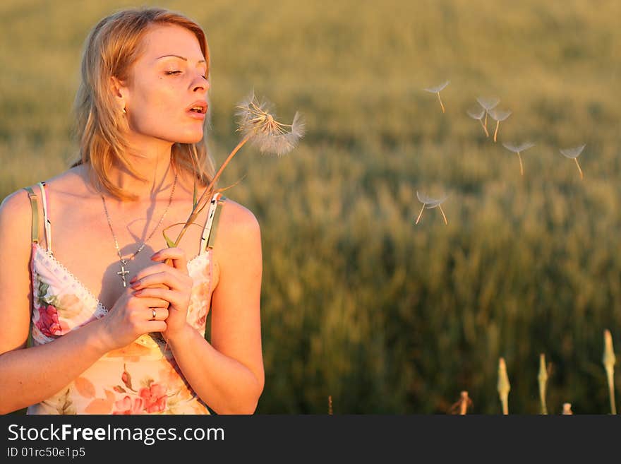 Woman and dandelion