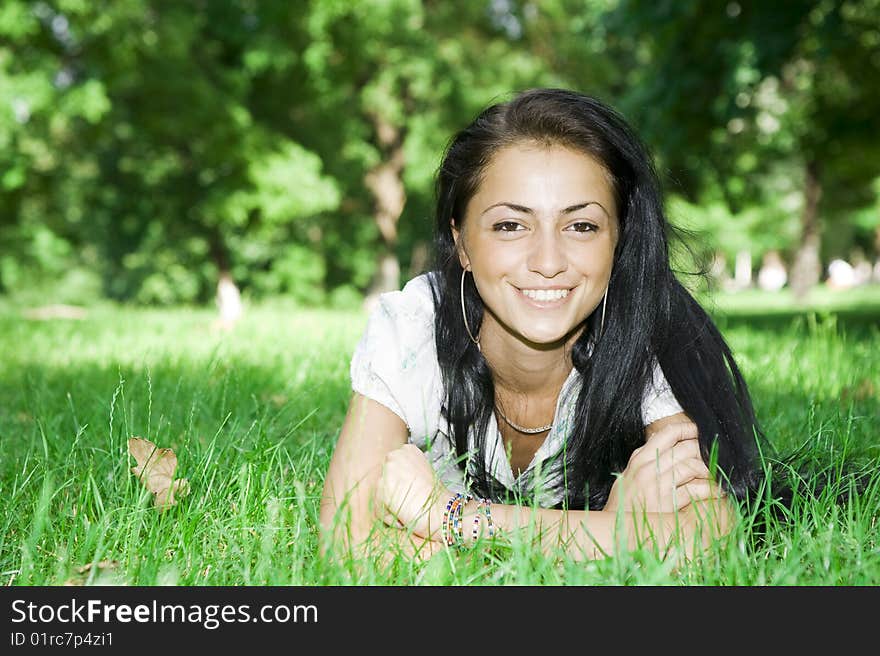 Pretty girl laying on the grass. Pretty girl laying on the grass