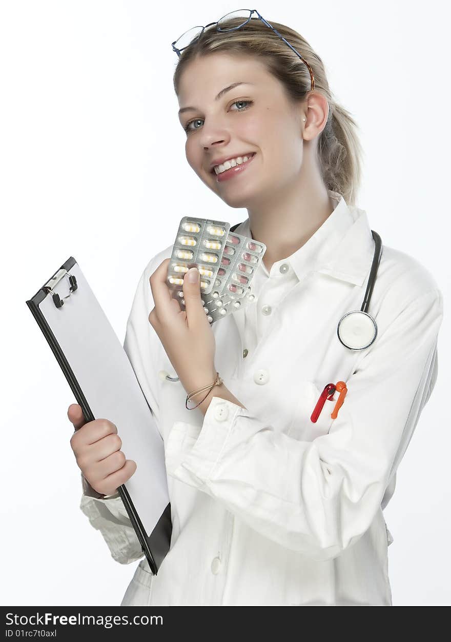 Female doctor handing medicine isolated on white