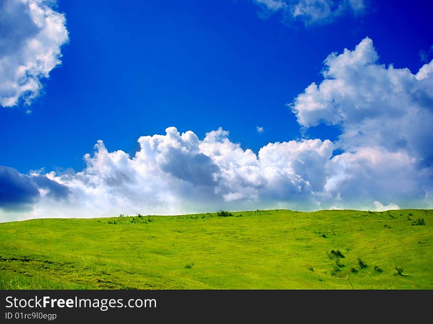 Green grassland and clouds