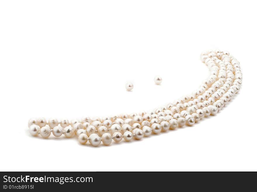 Pearl necklace look like a smile on white background. Pearl necklace look like a smile on white background