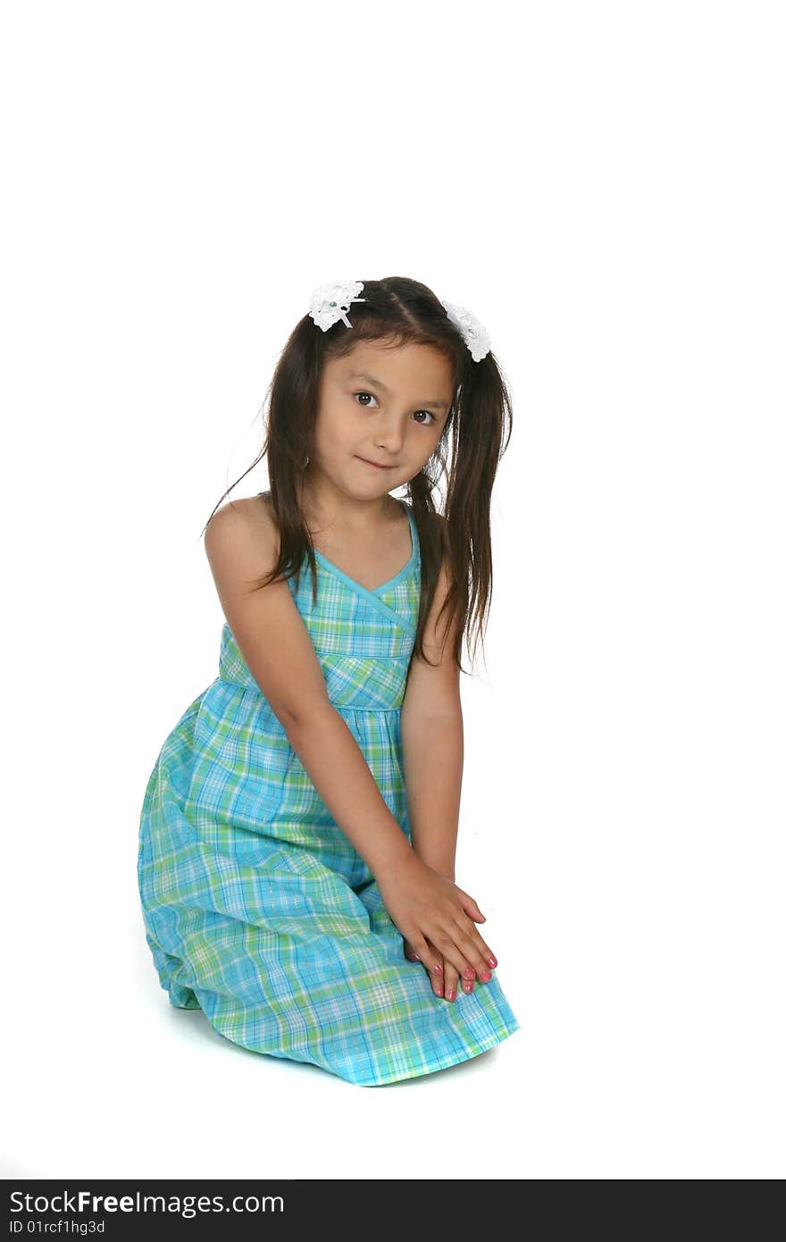 Cute Asian American girl in ponytails and blue dress. Cute Asian American girl in ponytails and blue dress