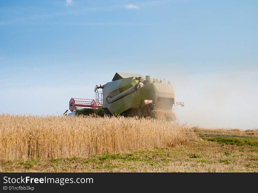 Combine harvester harvesting crop in the field.