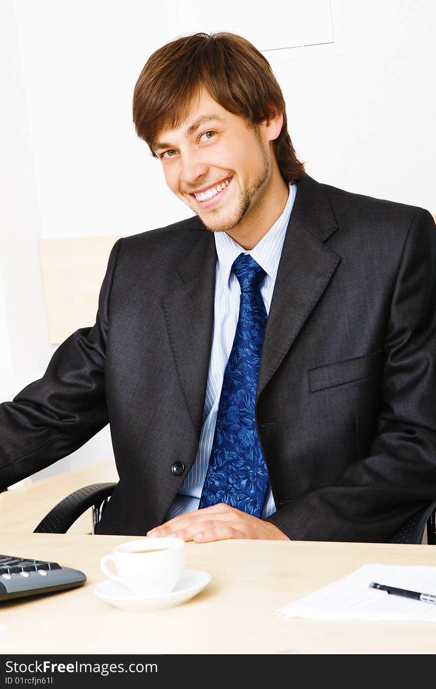 Successful businessman working at the computer in his office. Successful businessman working at the computer in his office