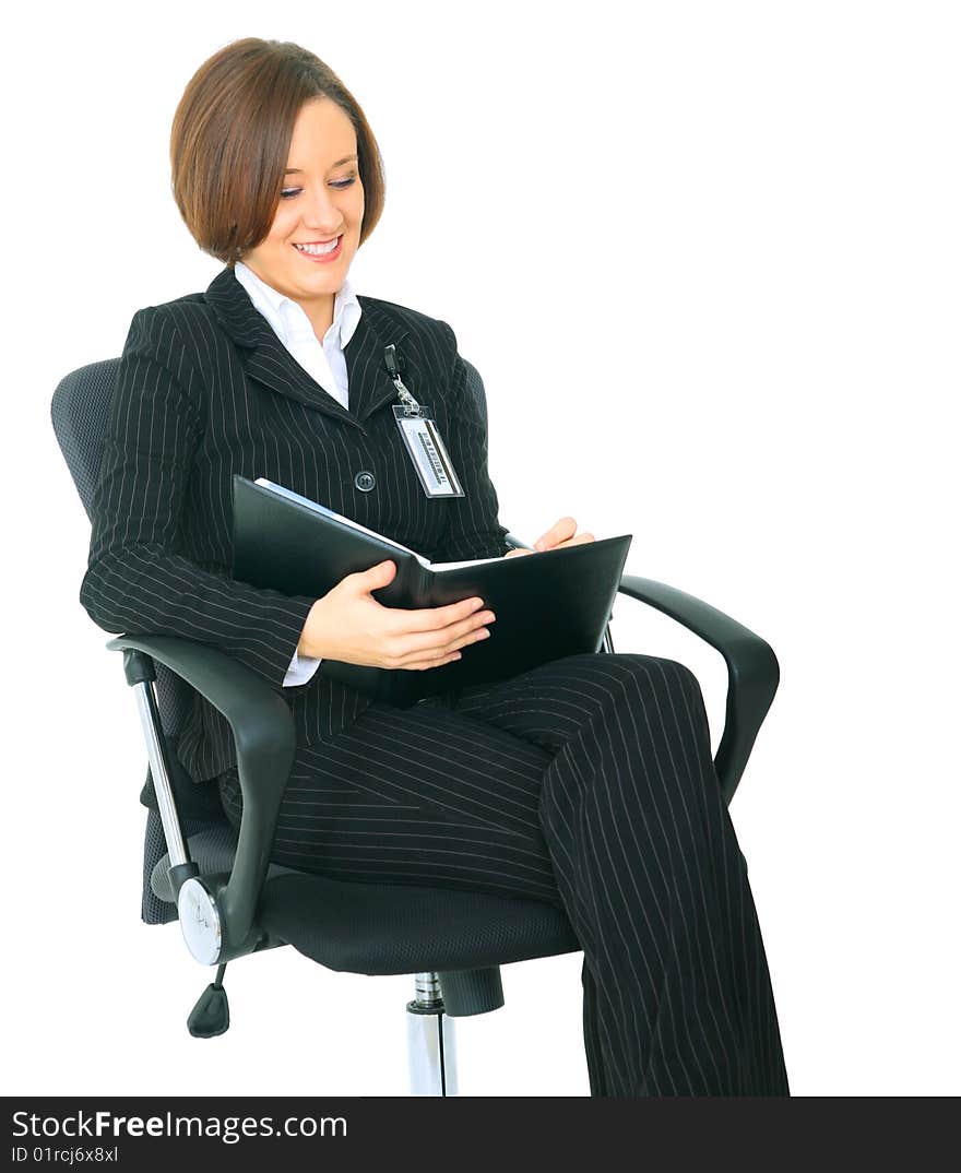 Isolated businesswoman sitting on chair as a boss looking at agenda. Isolated businesswoman sitting on chair as a boss looking at agenda