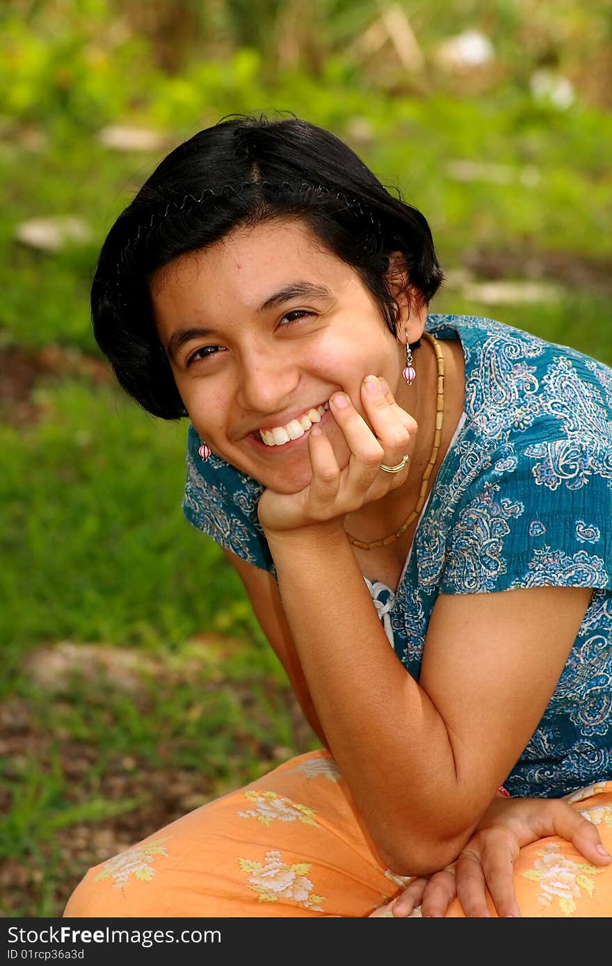 A girl happily posing for her photo shoot. A girl happily posing for her photo shoot.