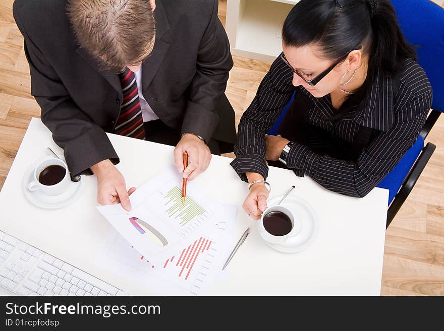 Business man and business woman working in office. Business man and business woman working in office