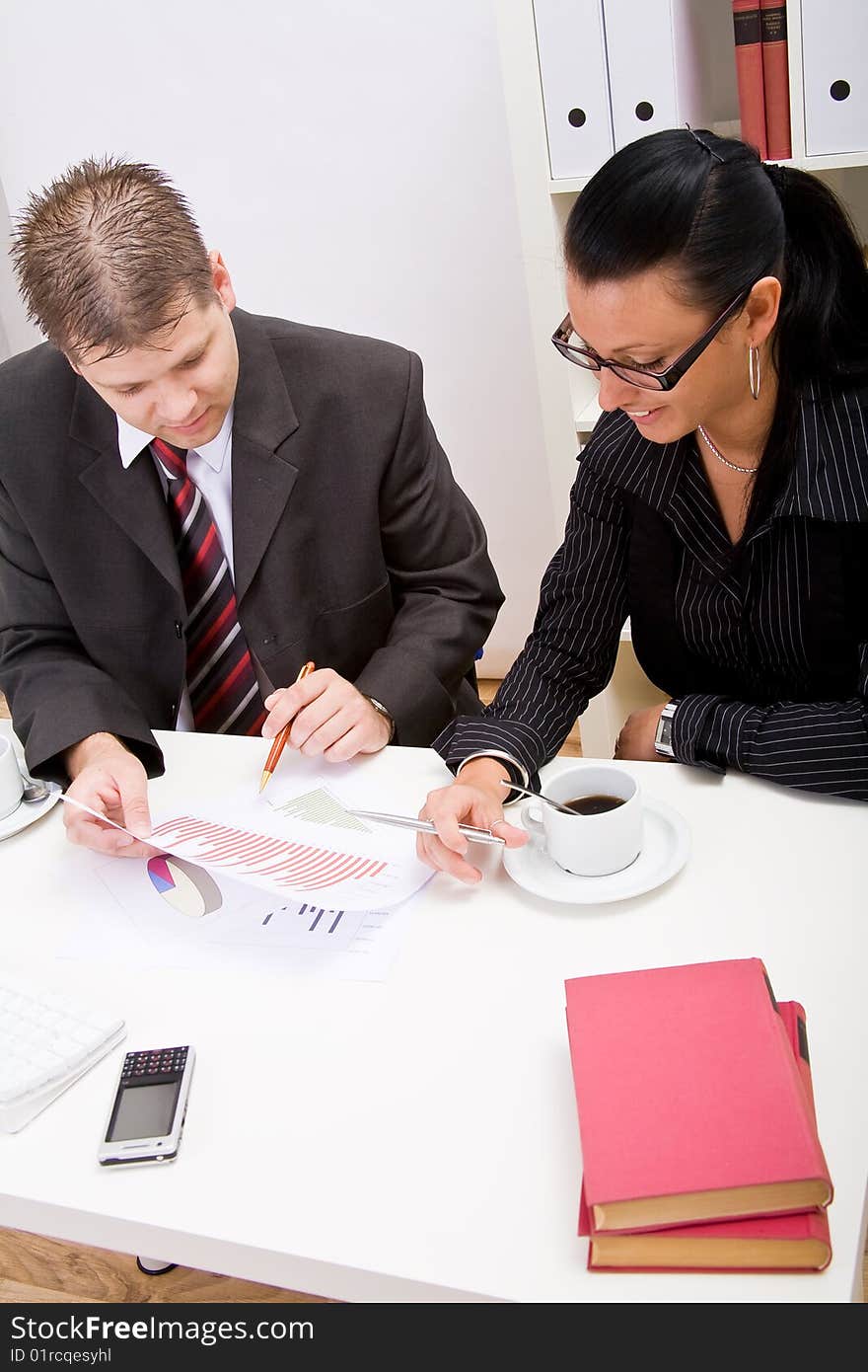 Business man and business woman working in office. Business man and business woman working in office