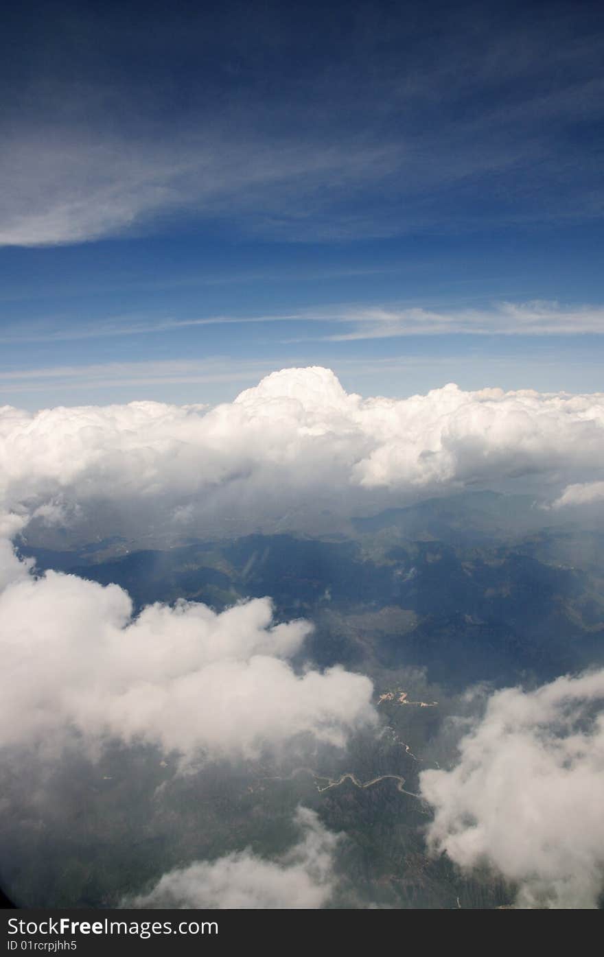 White clouds of surge on blue sky.