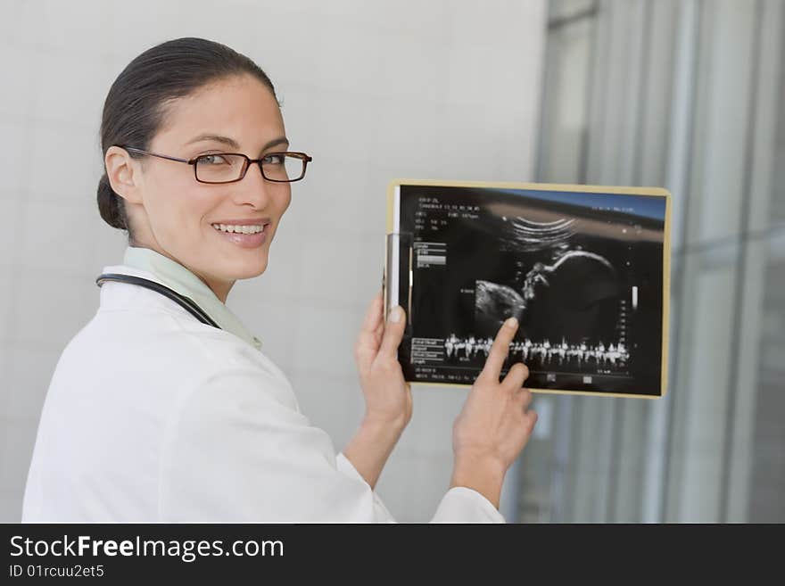 Close up of female doctor holding xray film. Close up of female doctor holding xray film