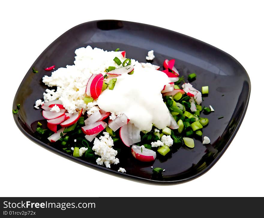 Plate of fresh salad isolated on white background