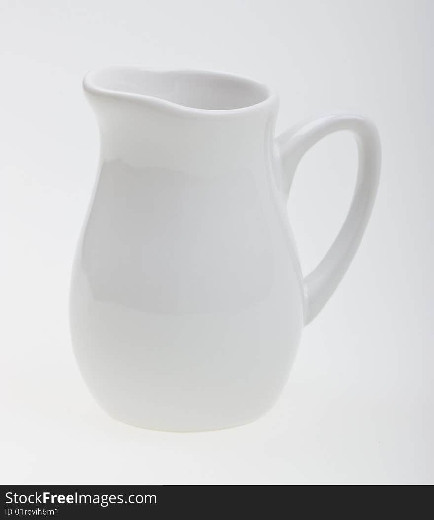 Close-up white jug to background