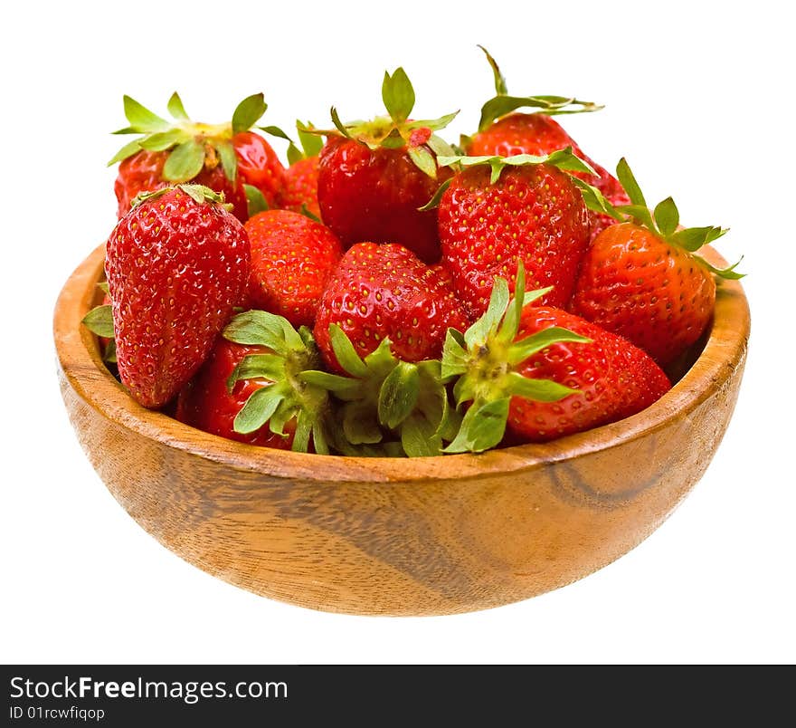 Fresh strawberries on a wooden platter