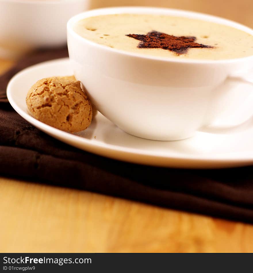 Close up of cappuccino with biscotti. Close up of cappuccino with biscotti