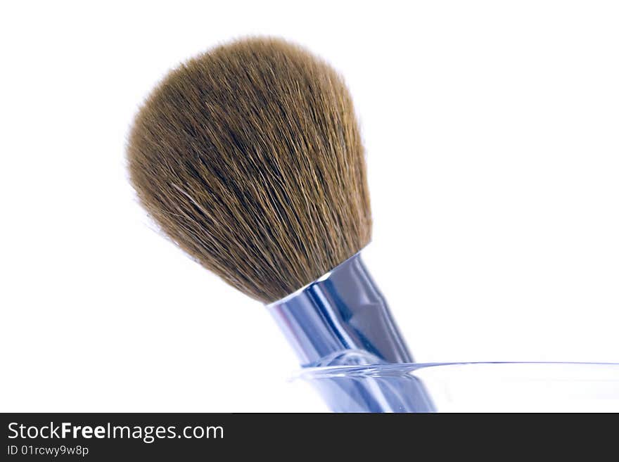 Make-up brush in a glass