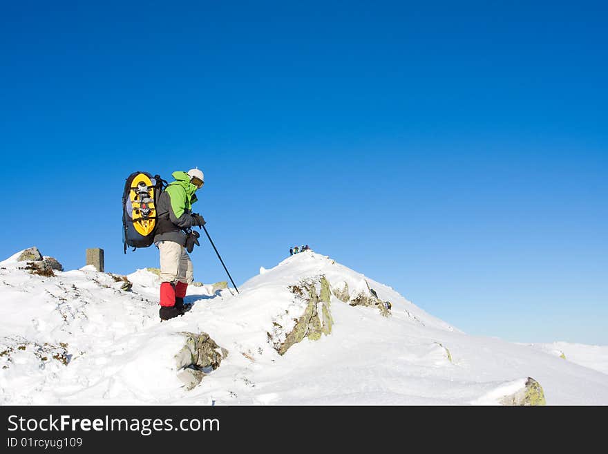 Hiker in winter in mountains. Hiker in winter in mountains