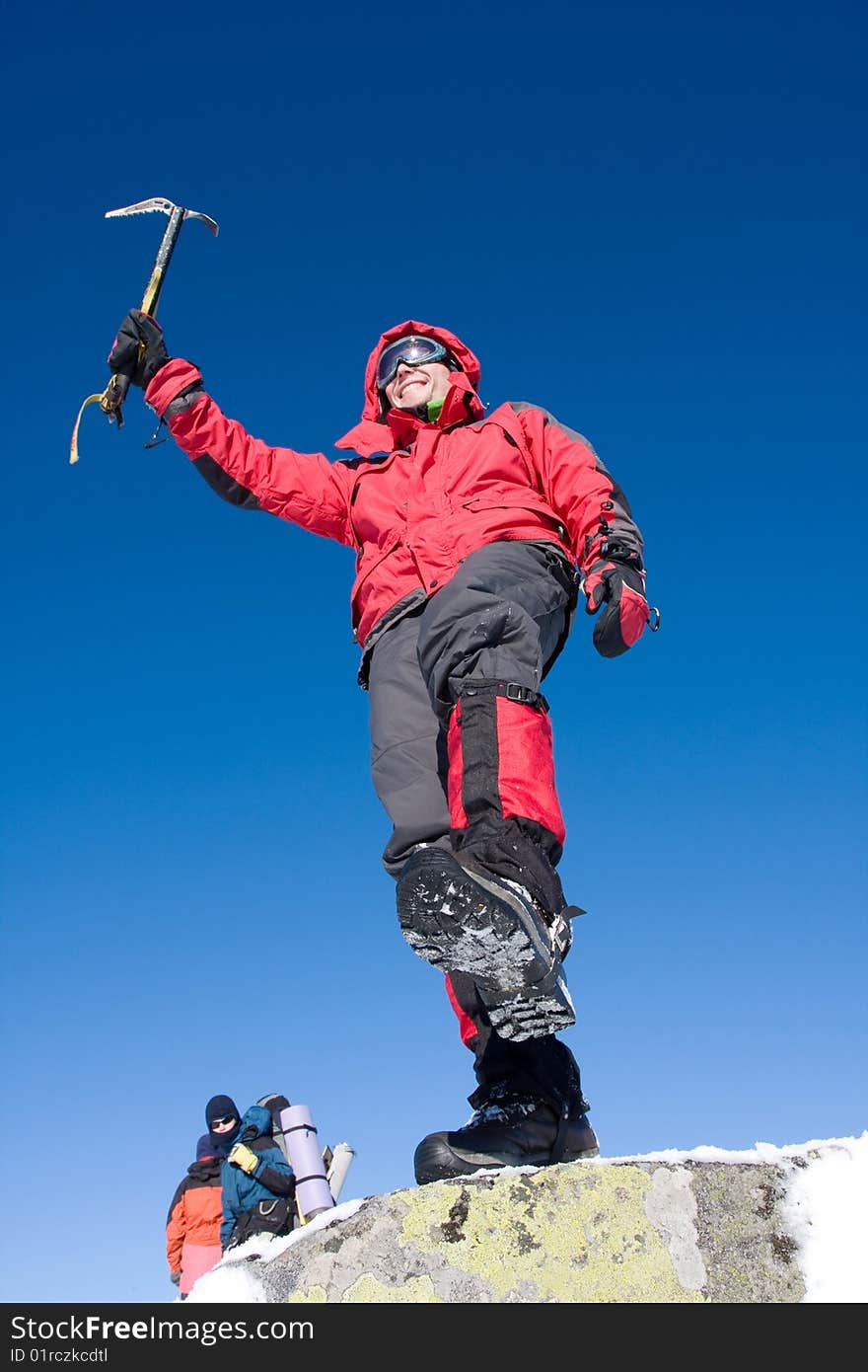 Hiker in winter in mountains