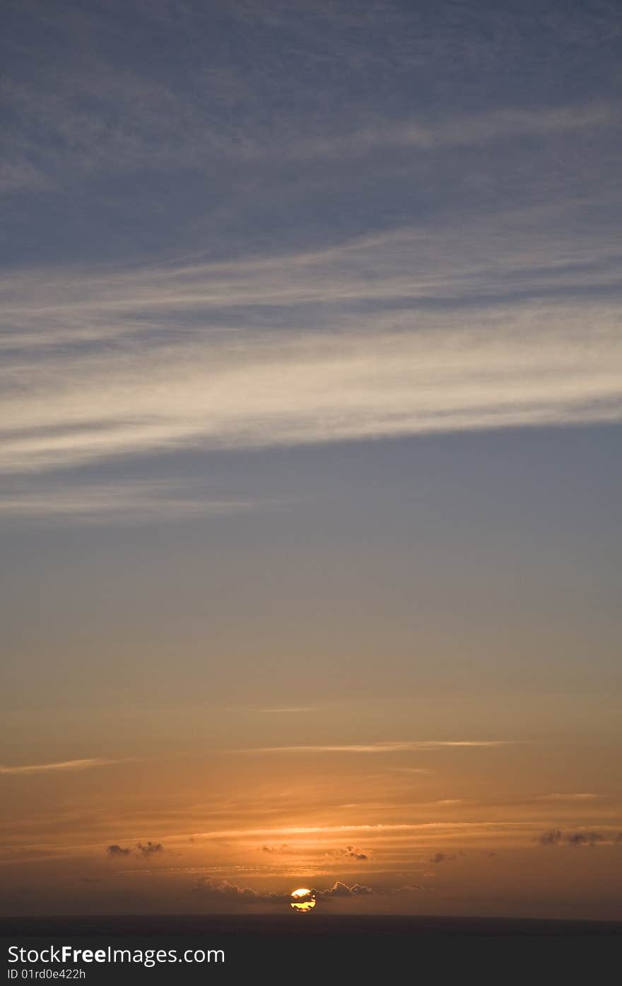 The sun setting over the ocean in Cornwall. The sun setting over the ocean in Cornwall