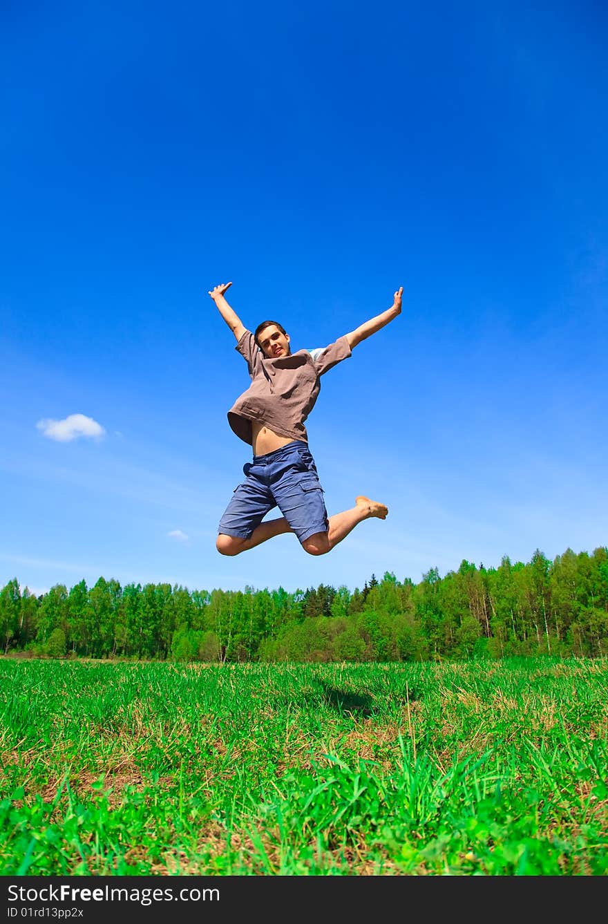 Man jumping against blue sky