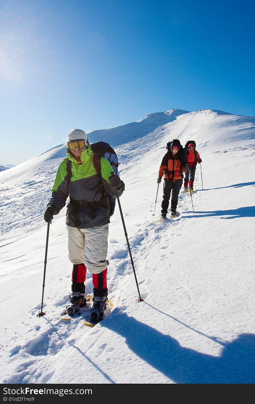 Hiker in winter in mountains