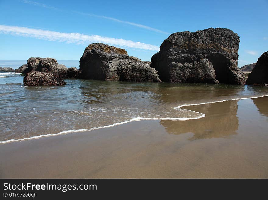 Rocks in the sand on the beautiful Oregon coast. Rocks in the sand on the beautiful Oregon coast