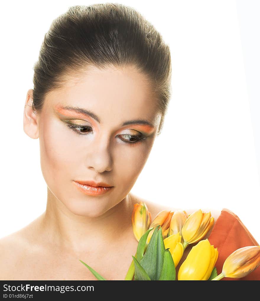 Portrait of young woman with yellow tulips. Portrait of young woman with yellow tulips