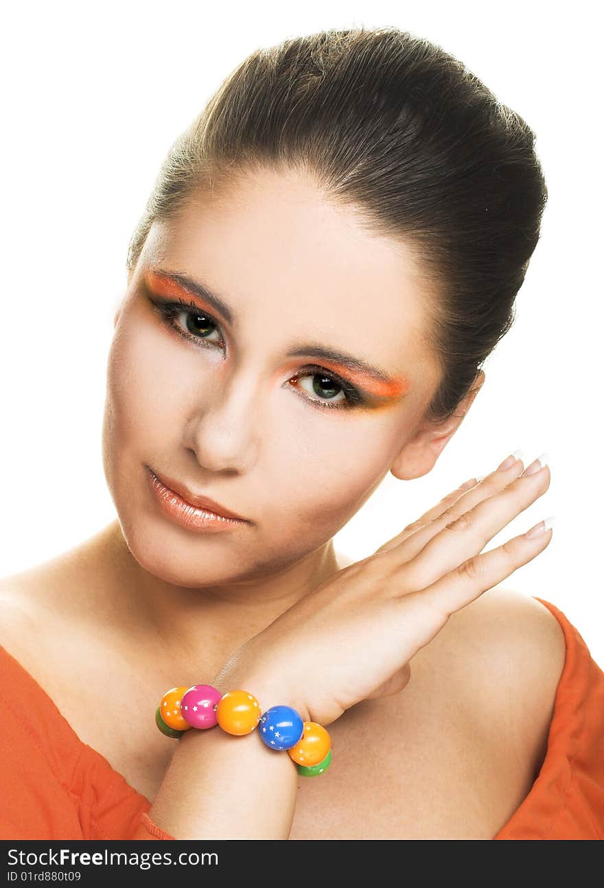 Romantic portrait of young brunette in bright bracelet. Romantic portrait of young brunette in bright bracelet.