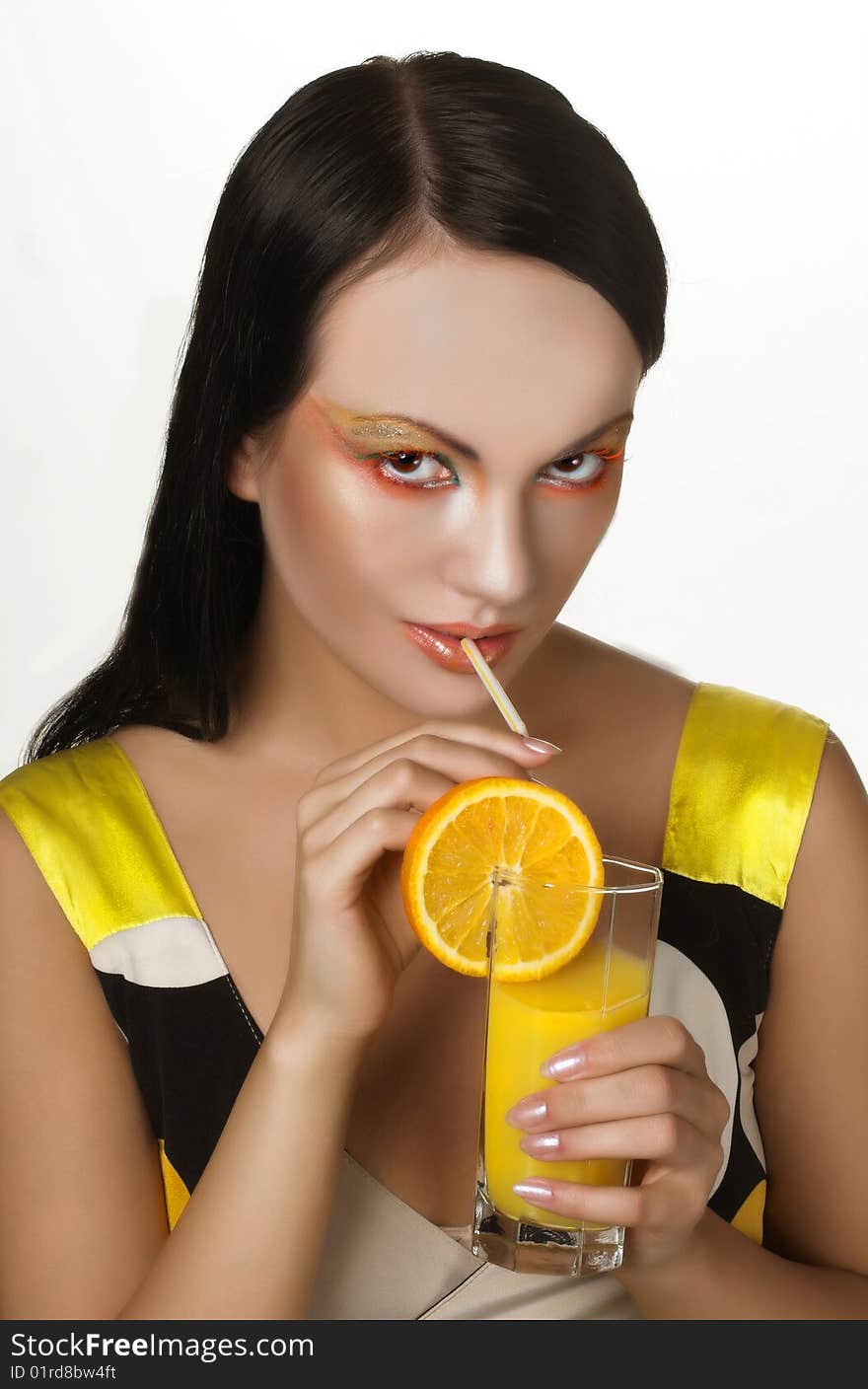 Romantic portrait of young charming lady with a glass of orange juice. Romantic portrait of young charming lady with a glass of orange juice.