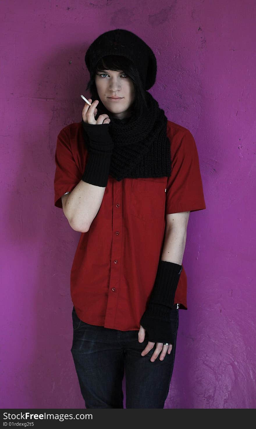 Portrait of young man in red shirt and black scarf. Portrait of young man in red shirt and black scarf