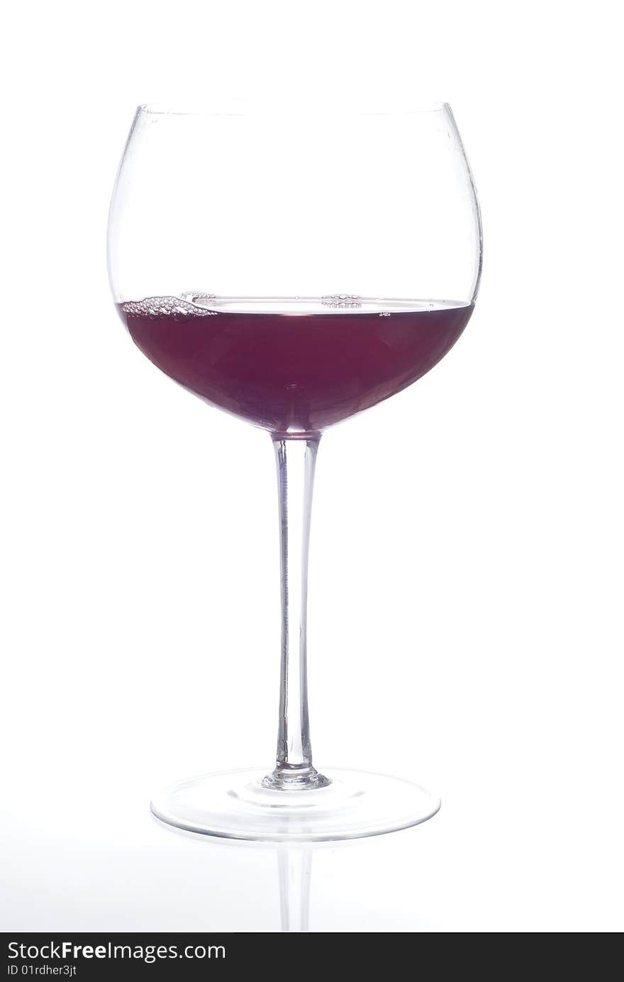 Glass of red beverage or wine