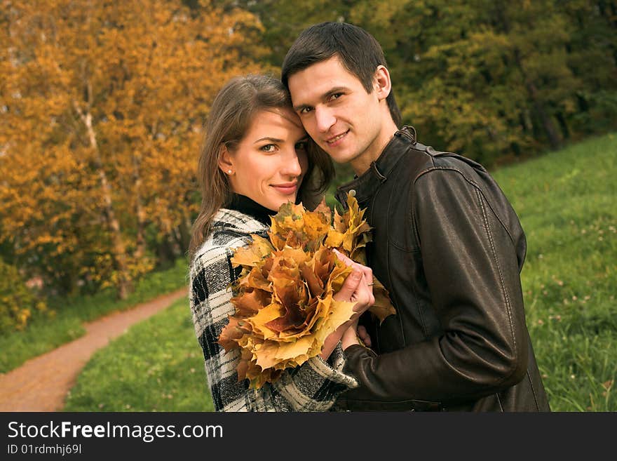 Young  couple in autumn park