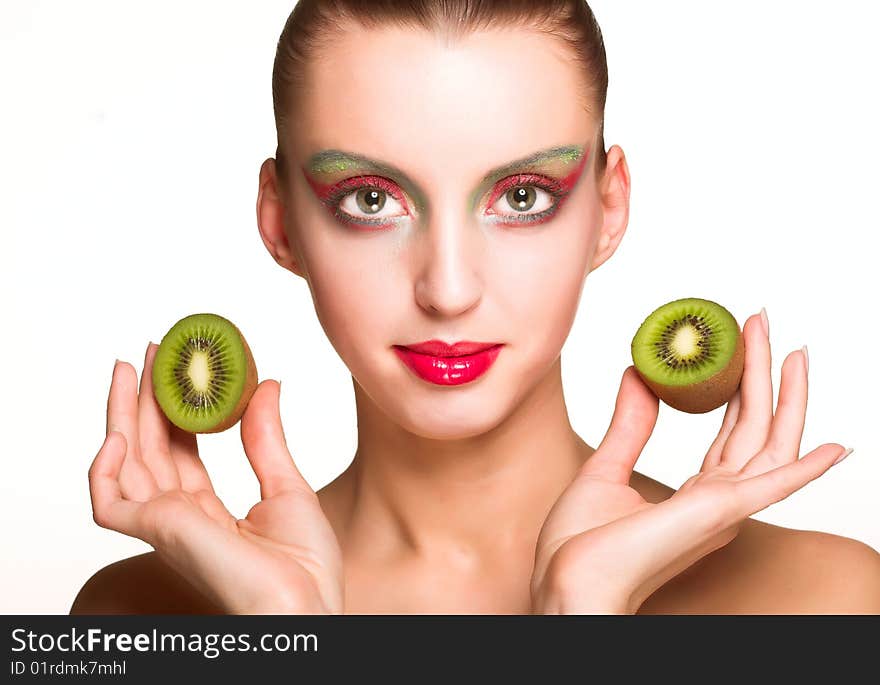 Beautiful woman`s face with kiwi. Beautiful woman`s face with kiwi