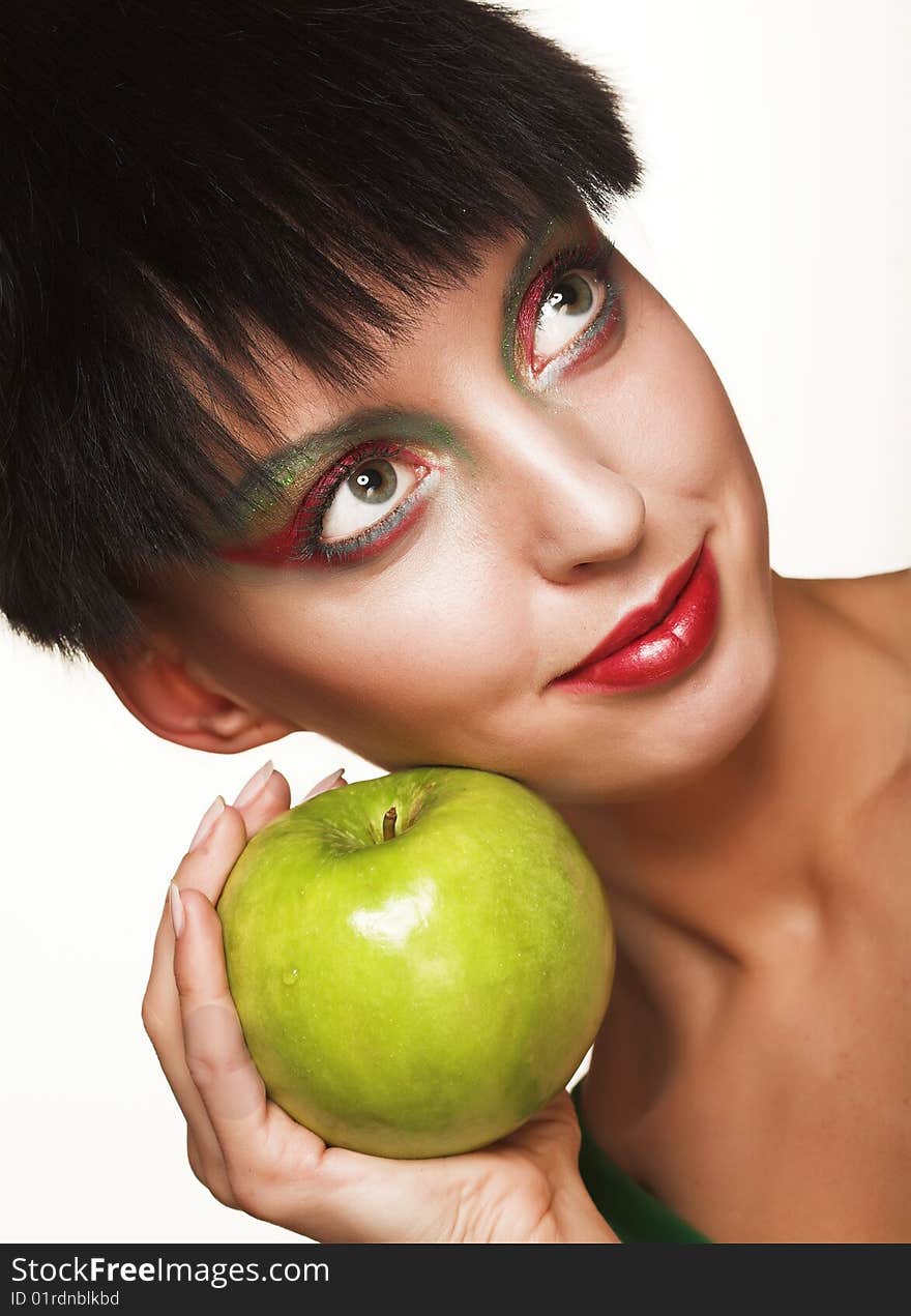 Beautiful woman with apple isolated on white