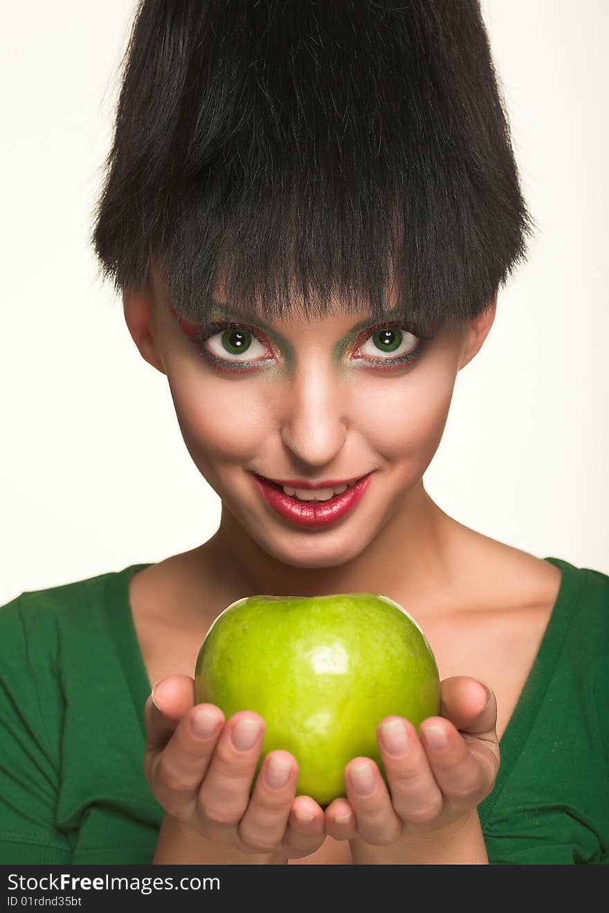 Beautiful woman with apple isolated on white